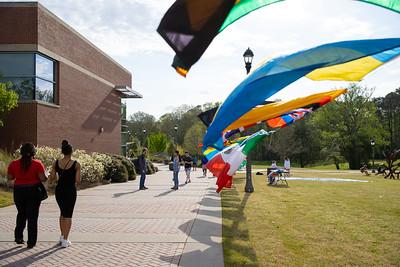 Flags from multiple countries waving in wind on-campus